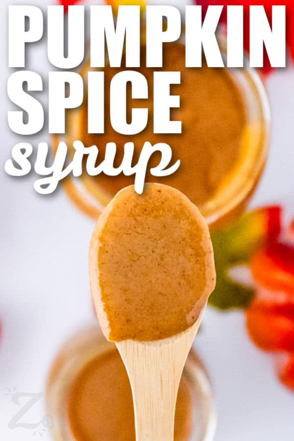 Pumpkin Spice Syrup on a wooden spoon with writing