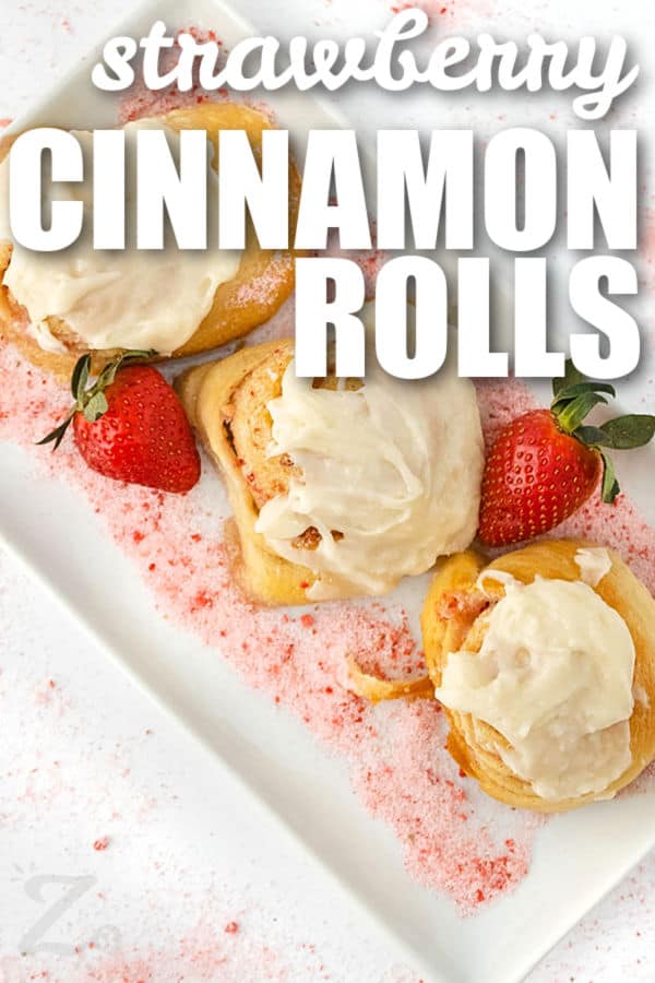 Strawberry Cinnamon Rolls with cream cheese frosting and a title