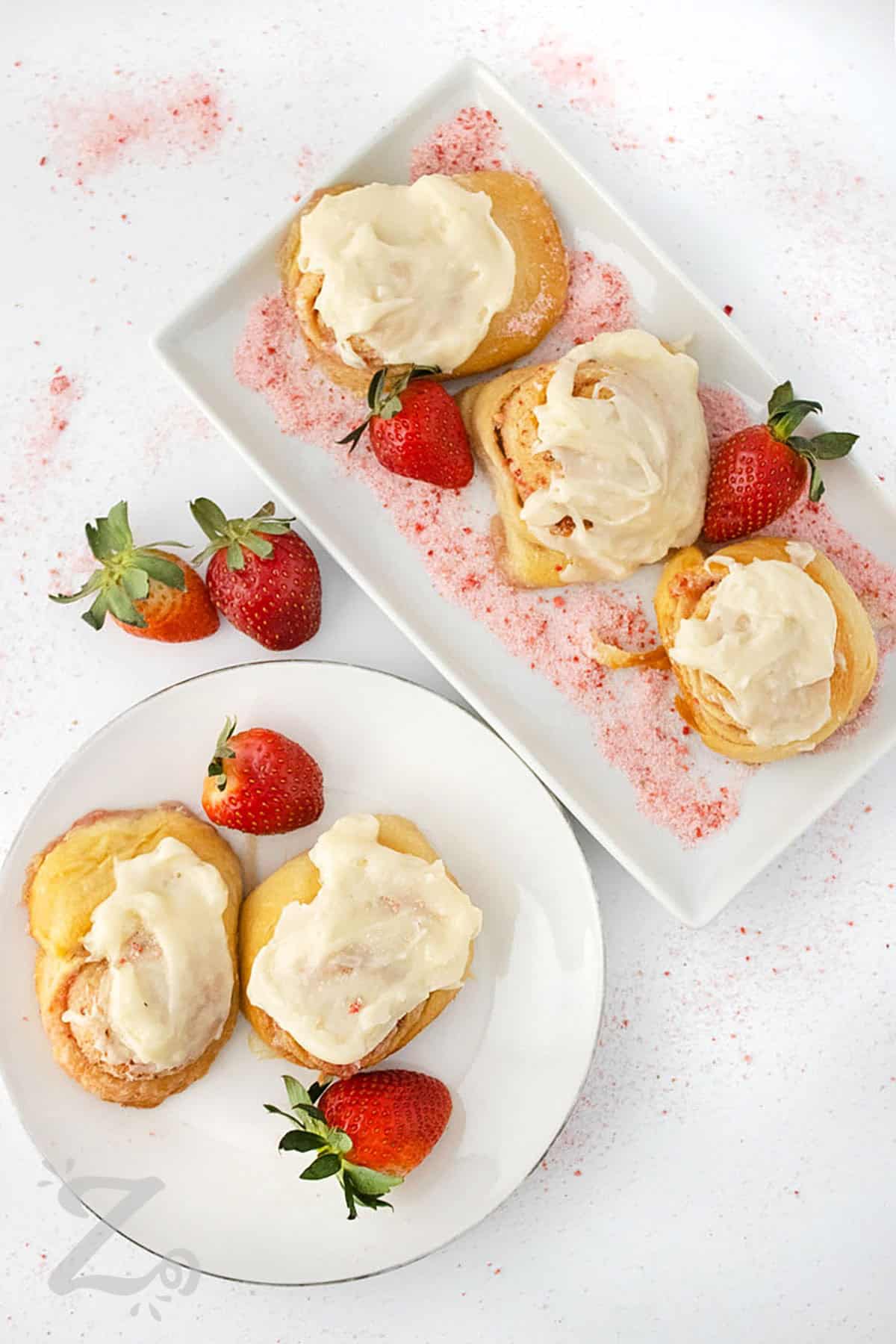 plates of Strawberry Cinnamon Rolls with strawberries