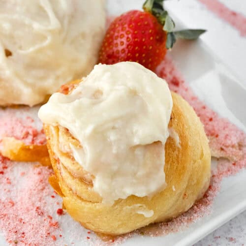 close up of Strawberry Cinnamon Rolls on a plate