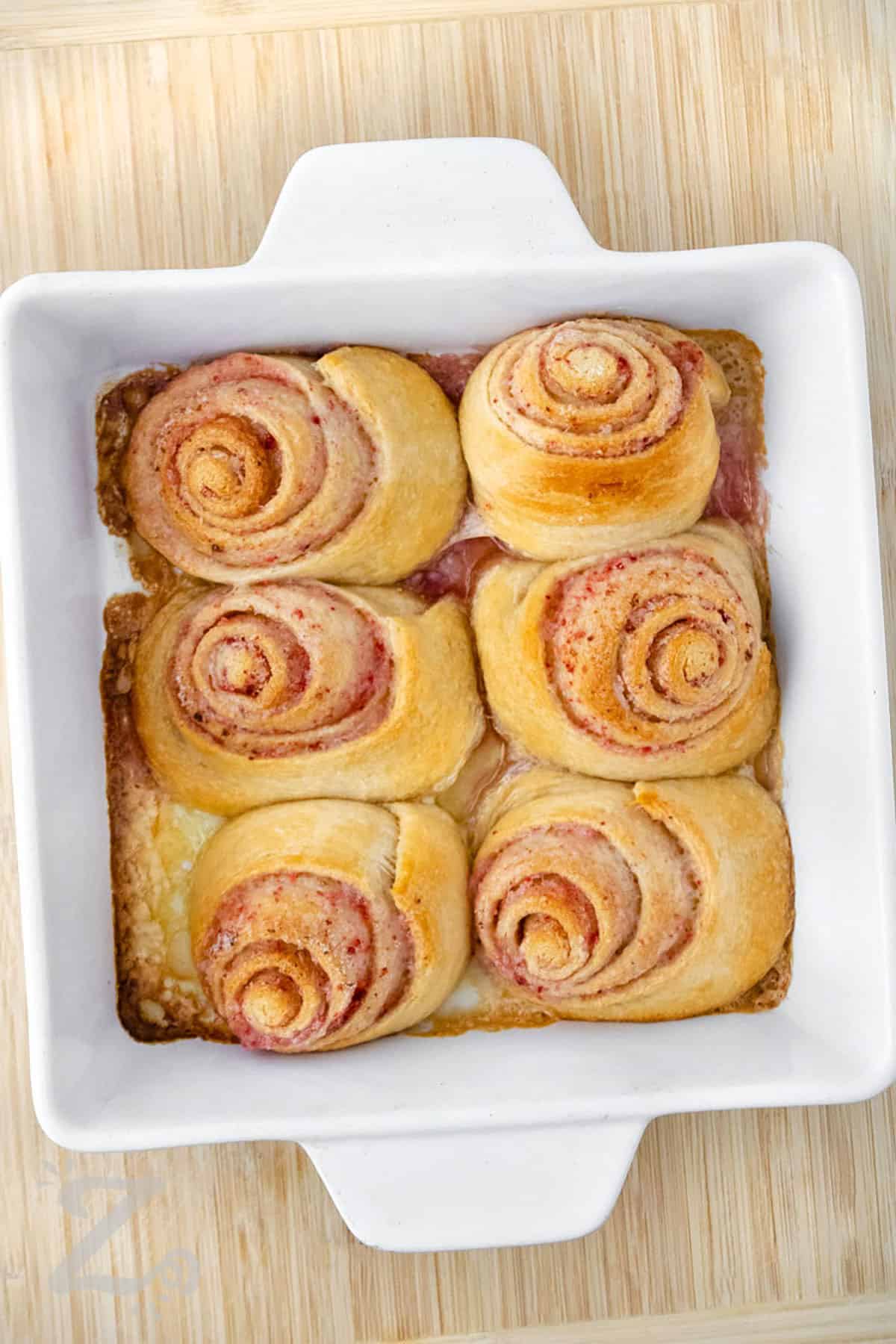 baking dish of Strawberry Cinnamon Rolls before putting on cream cheese frosting