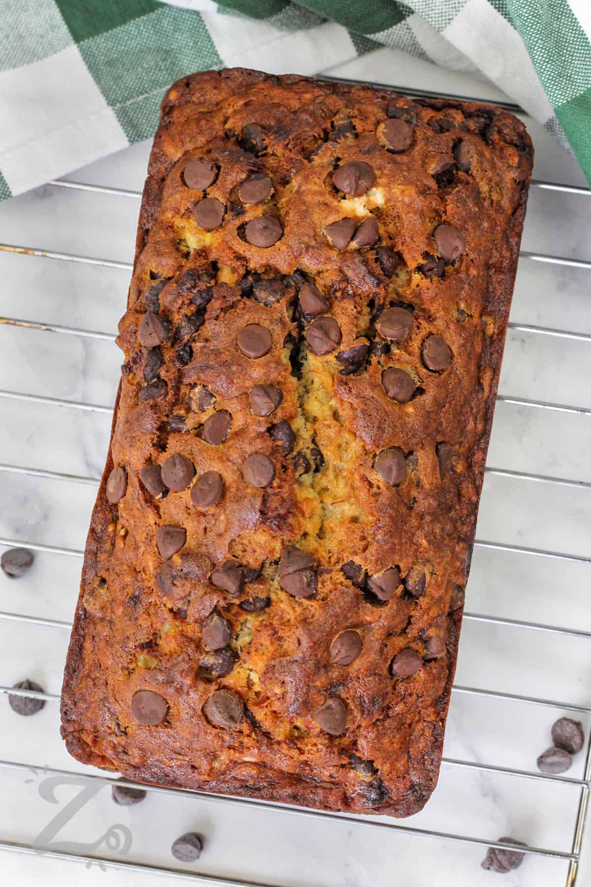 loaf of Chocolate Chip Banana Bread on a cooling rack