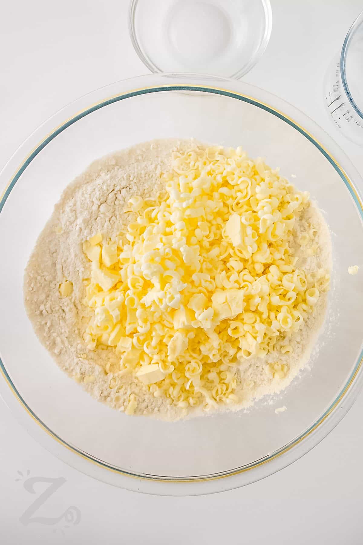 adding butter to dry ingredients to make Easy Pie Crust