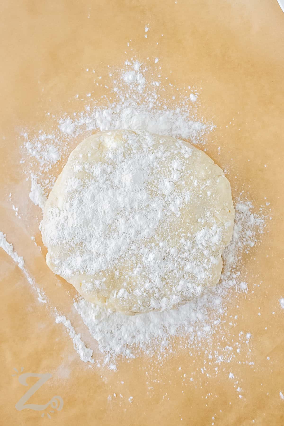 adding flour to Easy Pie Crust dough