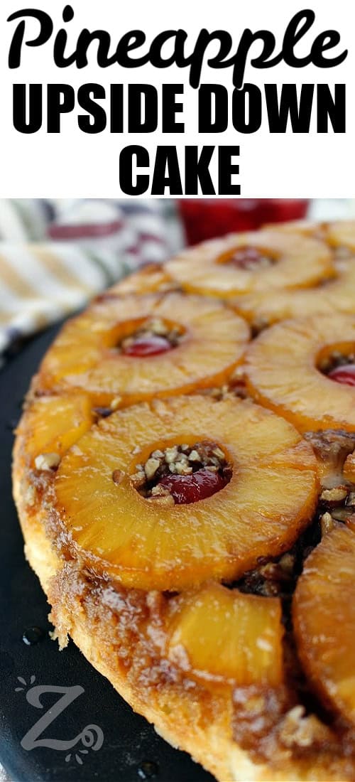 homemade pineapple upside down cake on on a serving platter, with a title