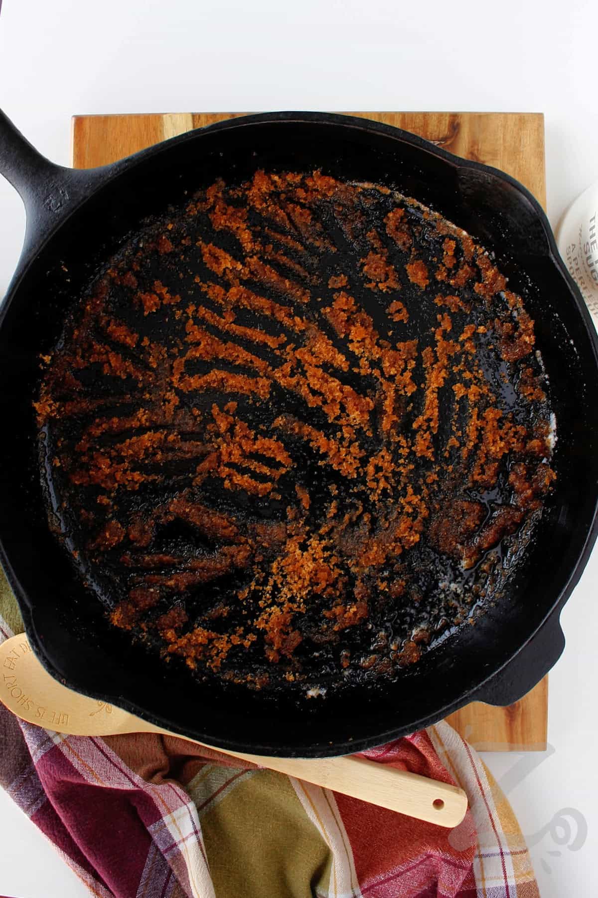 brown sugar and butter mixed in a cast iron skillet to make homemade pineapple upside down cake