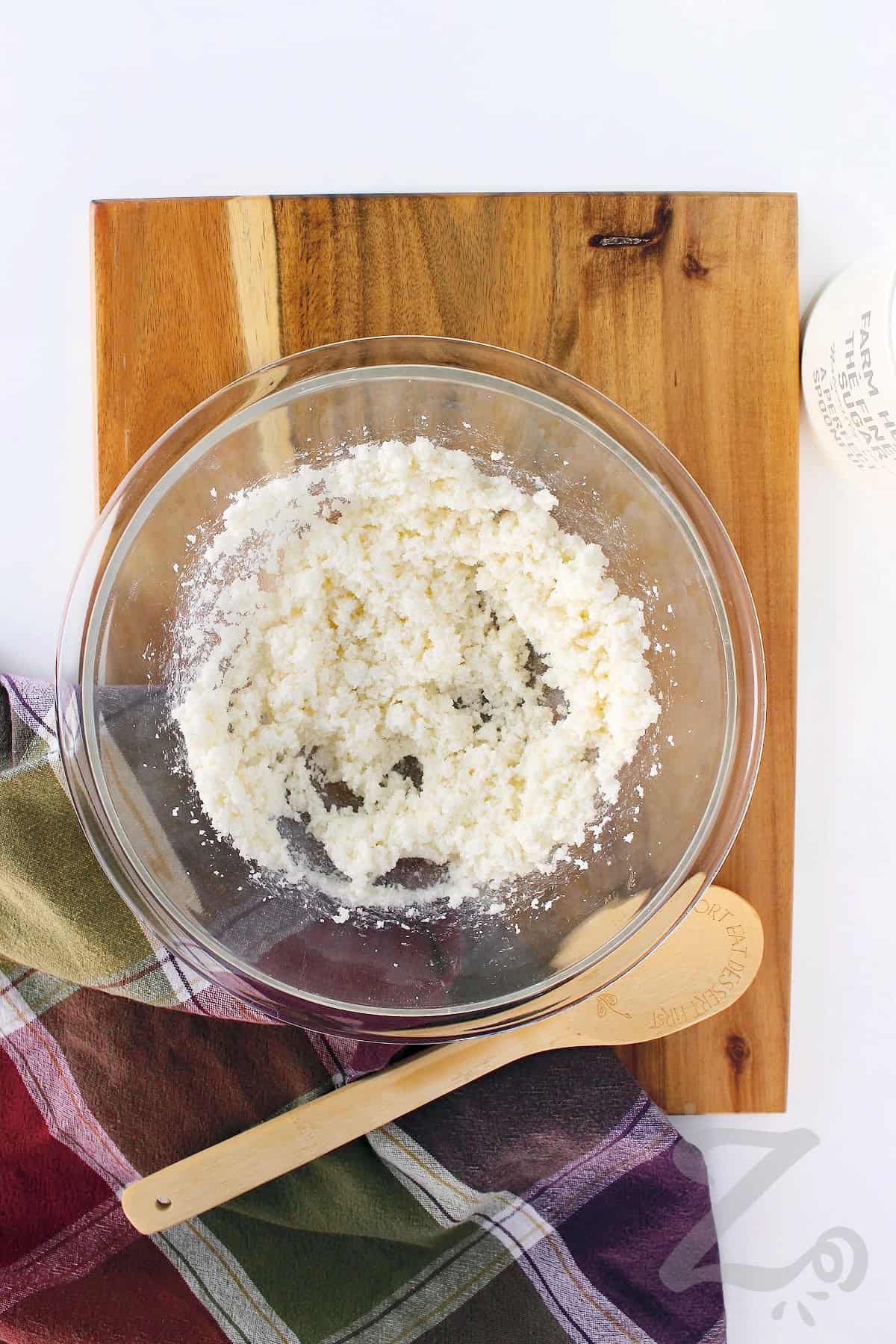 butter and sugar mixed together in a clear mixing bowl to make homemade pineapple upside down cake