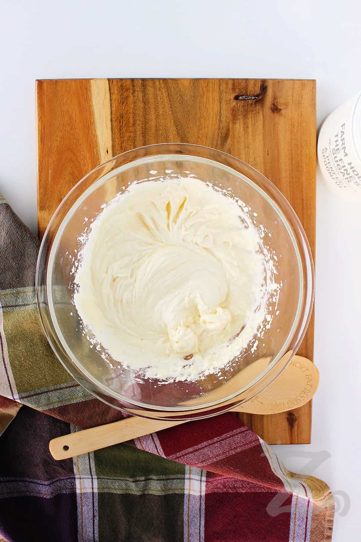 butter, sugar and eggs whipped in a clear mixing bowl to make homemade pineapple upside down cake  