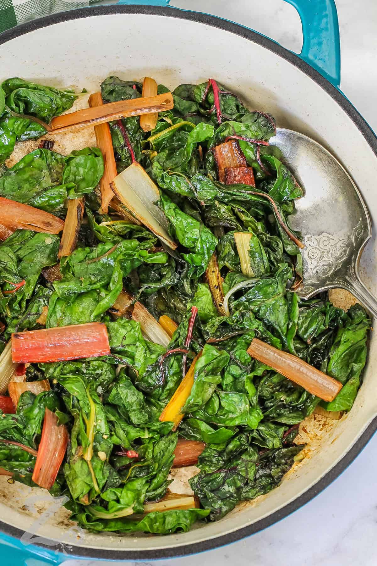 pan of cooked Swiss Chard with a spoon