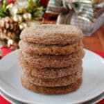 Snickerdoodle cookies stacked on a white plate