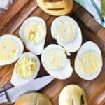 Smoked Eggs on a cutting boar with a knife