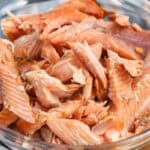 horizontal smoked trout in a clear bowl