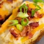 close up of cheesy Twice Baked Potatoes with bacon