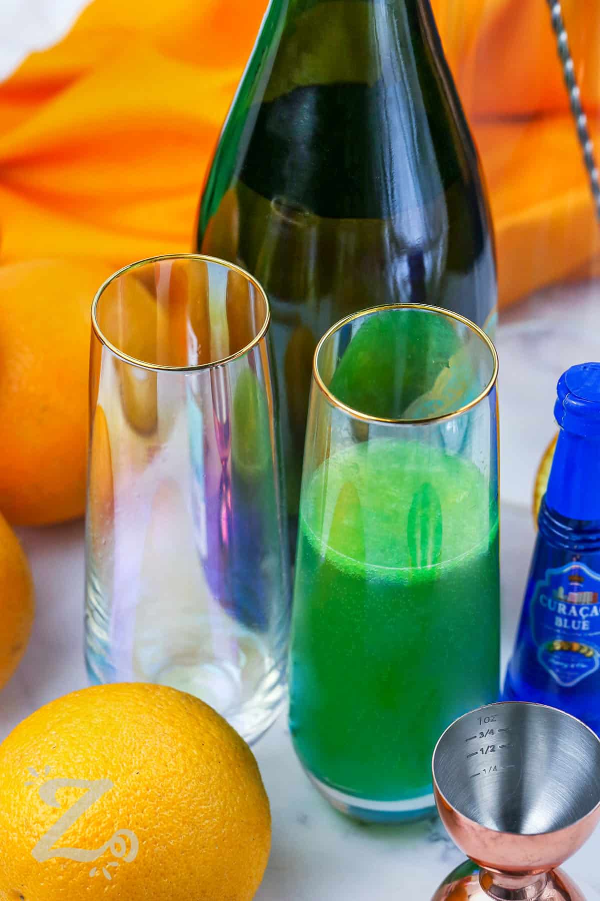 adding ingredients together in glass to make Green Mimosa