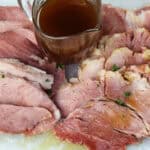 Honey Glazed Ham Recipe with a jar of honey glaze