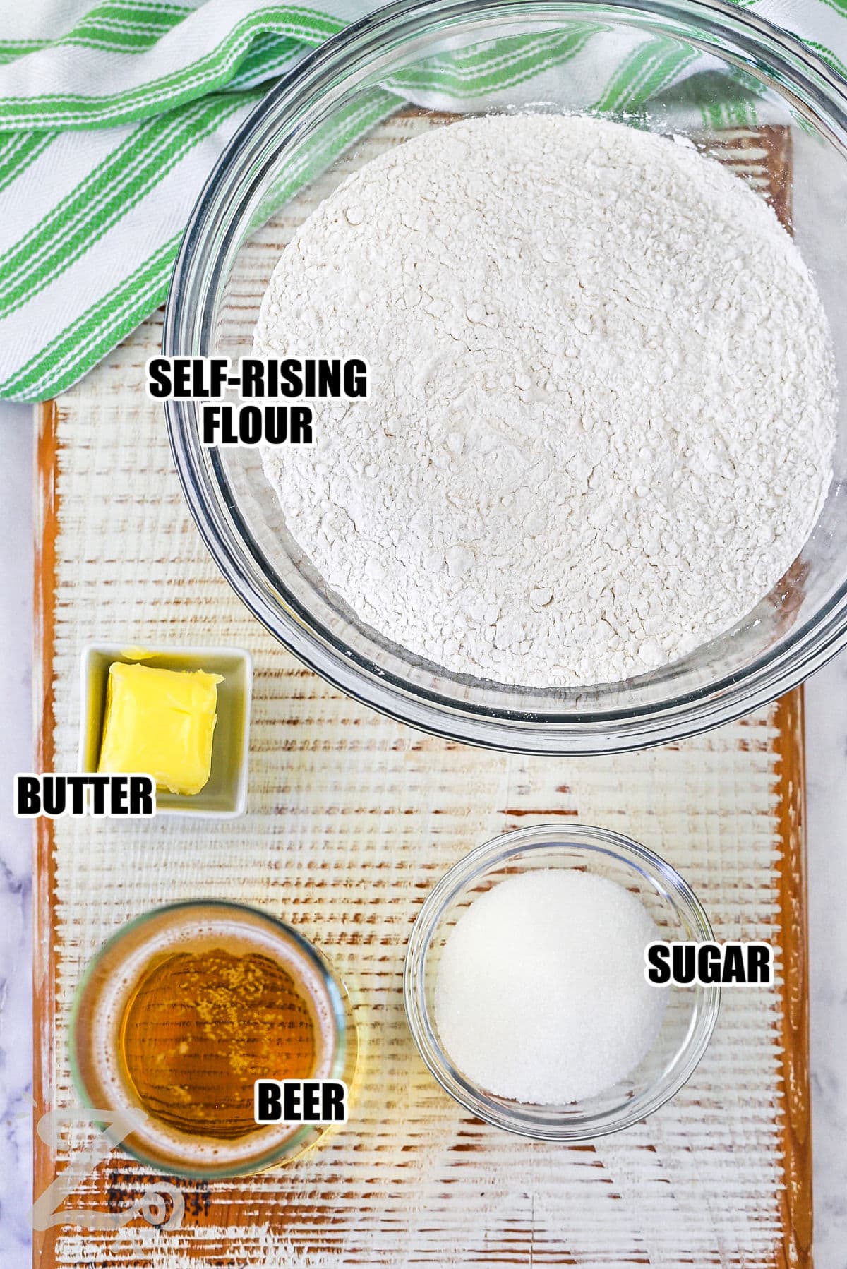self rising flour , sugar , butter , beer with labels to make Beer Bread Recipe