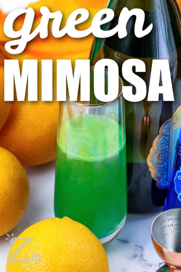 Green Mimosa with chapagne bottle and oranges and a title