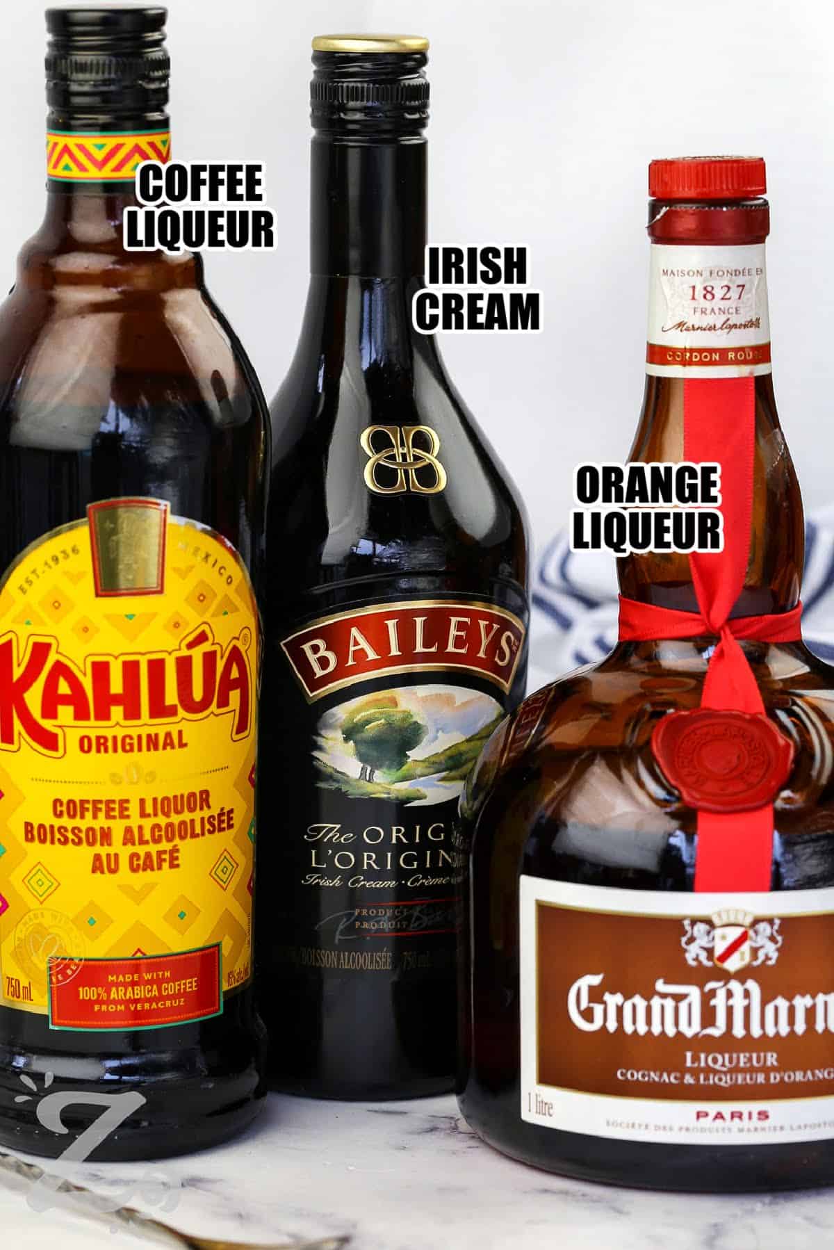 coffee liqueur , irish cream , orange liqueur with labels to make B52 Drink