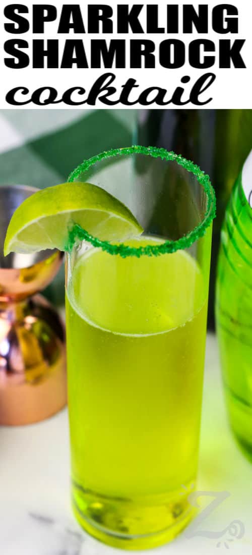 glass of Sparkling Shamrock Cocktail with lime and a title