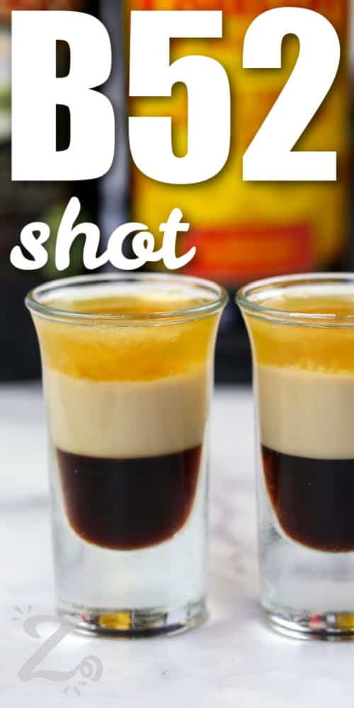 shot glasses of layered B52 Drink with a title