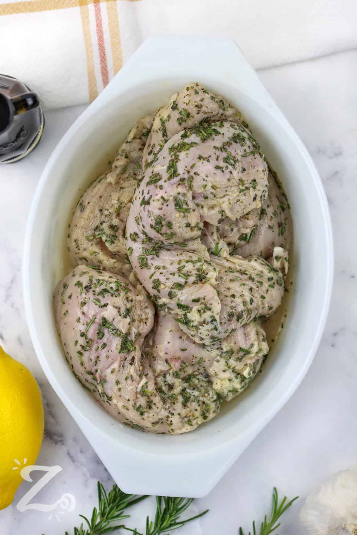 adding seasoned chicken to dish to make Grilled Chicken