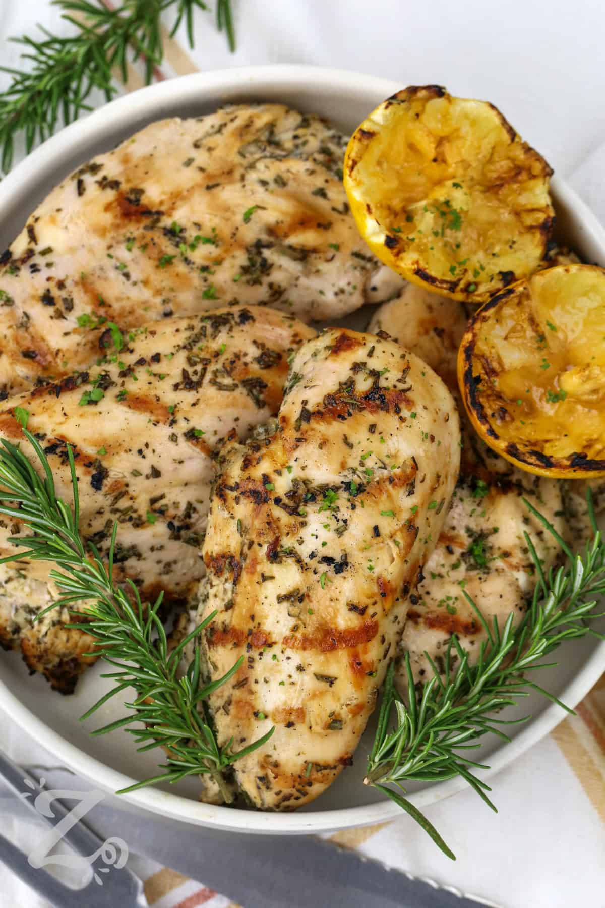 plated Grilled Chicken with lemon and rosemary