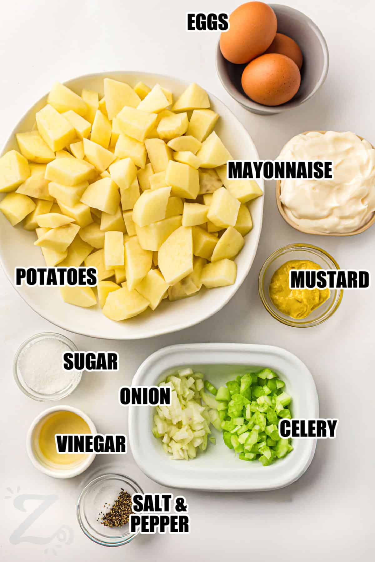 Classic potato salad recipe lovers will enjoy every creamy bite of this homemade side dish. Potatoes and chopped eggs are tossed with celery and onion in a rich dressing made with mayo, mustard, and apple cider vinegar. This chilled potato salad is perfect for summer barbecues, family dinners, and holiday gatherings. It is a classic side that goes well with grilled meats and sandwiches. #ourzestylife potatoes , eggs , mayonnaise , mustard , sugar , onion , celery , vinegar , salt and pepper with labels to make Classic Potato Salad