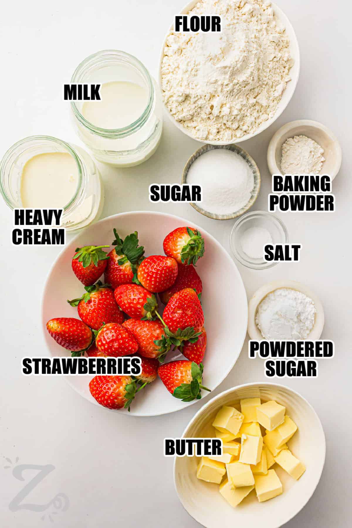 flour , milk , heavy cream , sugar , baking powder , salt , powdered sugar , butter and strawberries with labels to make Strawberry Shortcake