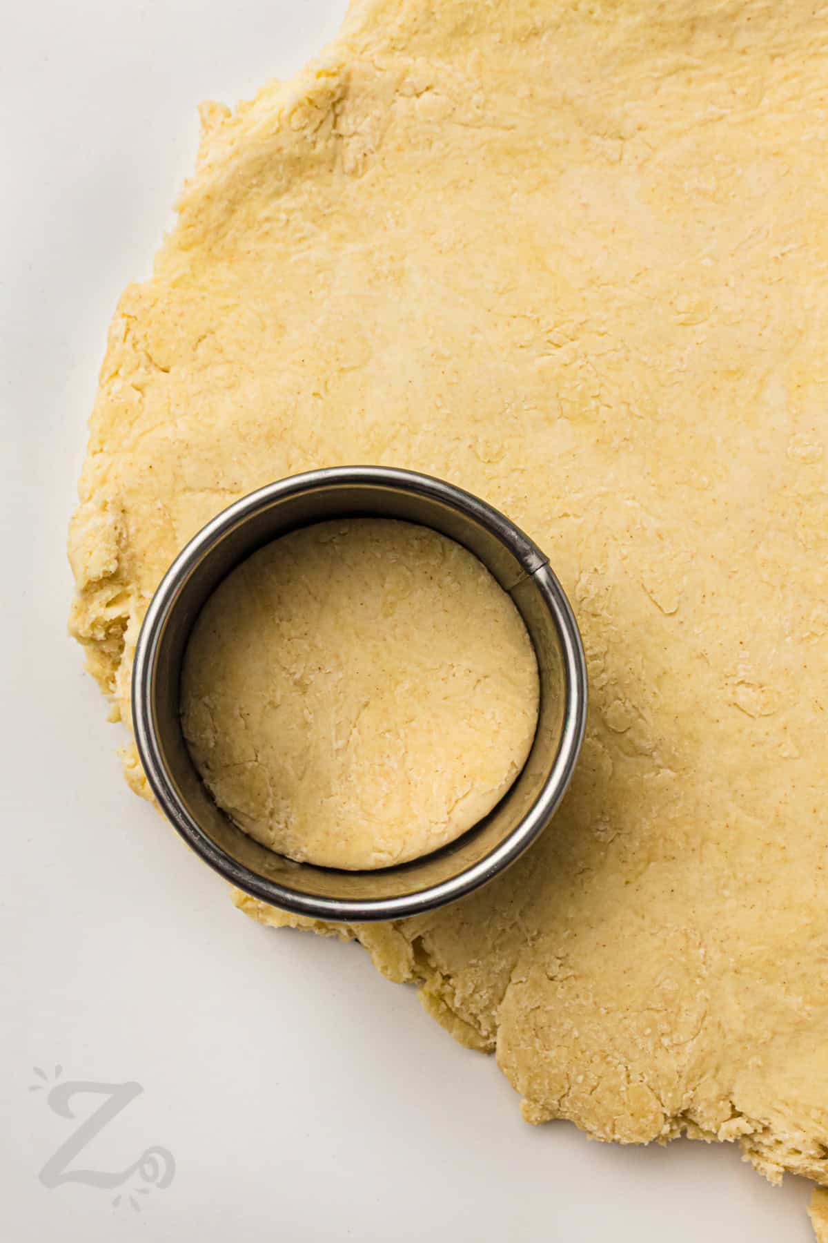 cutting circles out of shortcake dough to make Strawberry Shortcake