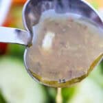 close up of zesty Italian dressing in a heart shaped spoon