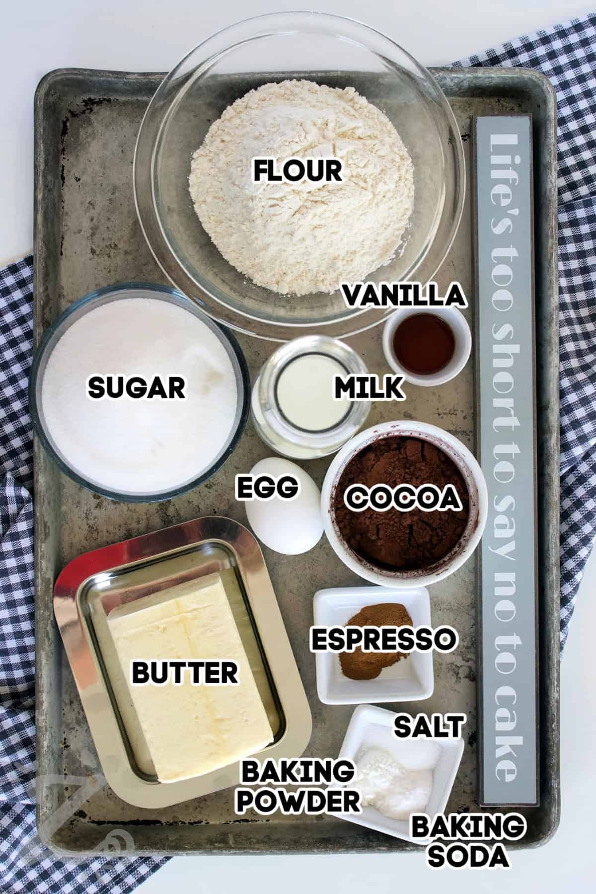 Make this classic homemade chocolate cake for a soft, rich, and perfectly moist cake every time. The deep cocoa flavor makes it a go to favorite for dessert lovers and chocolate lovers alike. Made from scratch with basic ingredients, this recipe is ideal for celebrations or simple weeknight desserts so why not give it a try? #ourzestylife flour, vanilla, milk, cocoa, espresso, salt, baking soda, baking powder, butter, egg, and sugar assembled to make homemade chocolate cake
