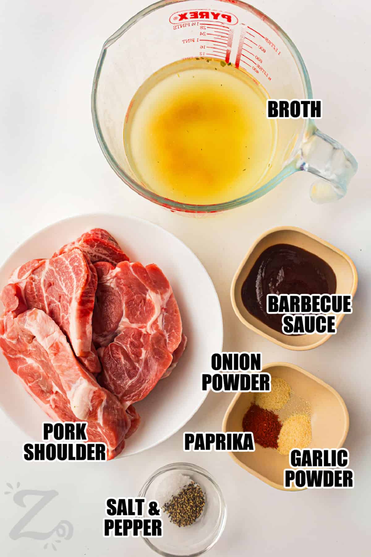 broth , barbecue sauce , onion powder , paprika , garlic powder , pork shoulder , salt and pepper with labels to make Slow Cooker BBQ Pulled Pork