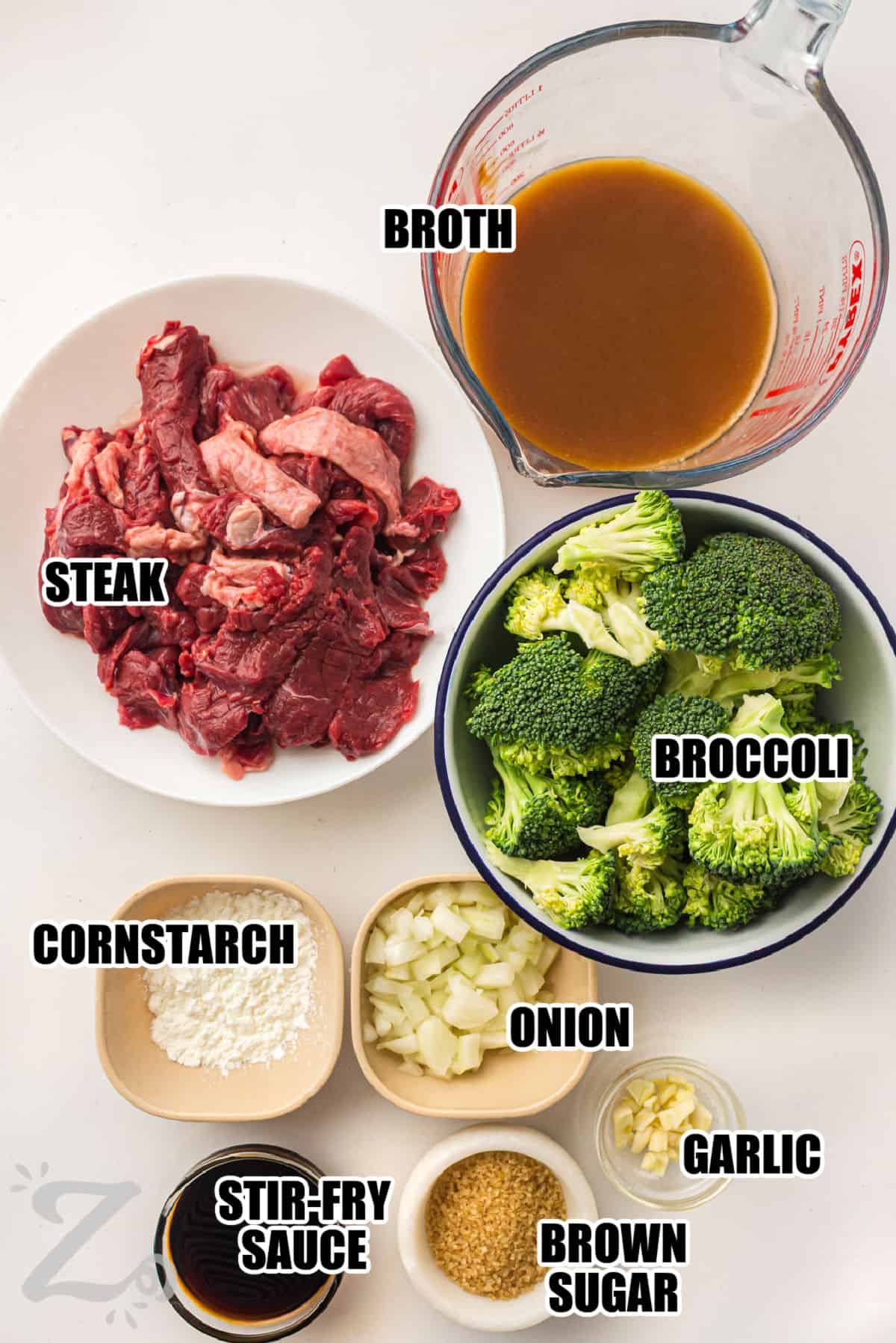 Slow cooker beef and broccoli is an easy way to enjoy comforting Asian inspired flavors at home. The beef becomes tender as it simmers in a savory garlic soy sauce. The sauce thickens into a glossy coating that tastes like restaurant-style cooking. It is perfect served with rice or noodles for a filling meal. Cook it for dinner and enjoy a cozy homemade dish. #ourzestylife broth , steak , broccoli , cornstarch , onion , garlic , brown sugar , stir-fry sauce with labels to make Grilled Quesadillas
