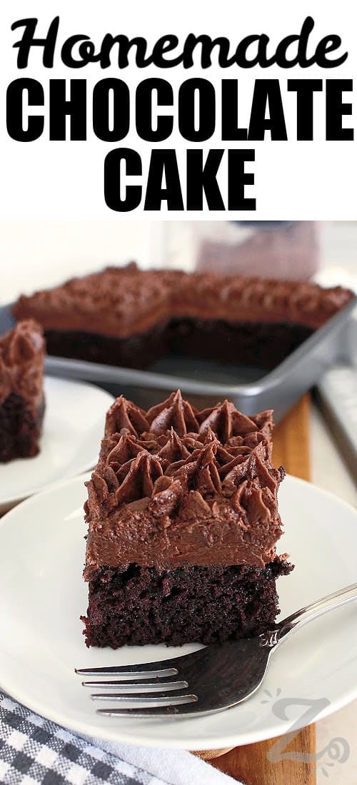 This easy homemade chocolate cake is proof that simple ingredients can create something truly special. It comes together quickly, bakes into a moist and fluffy cake, and delivers rich chocolate flavor in every bite. Serve it frosted or enjoy it plain with coffee, tea, or milk. #ourzestylife a slice of homemade chocolate cake on a white plate with a title