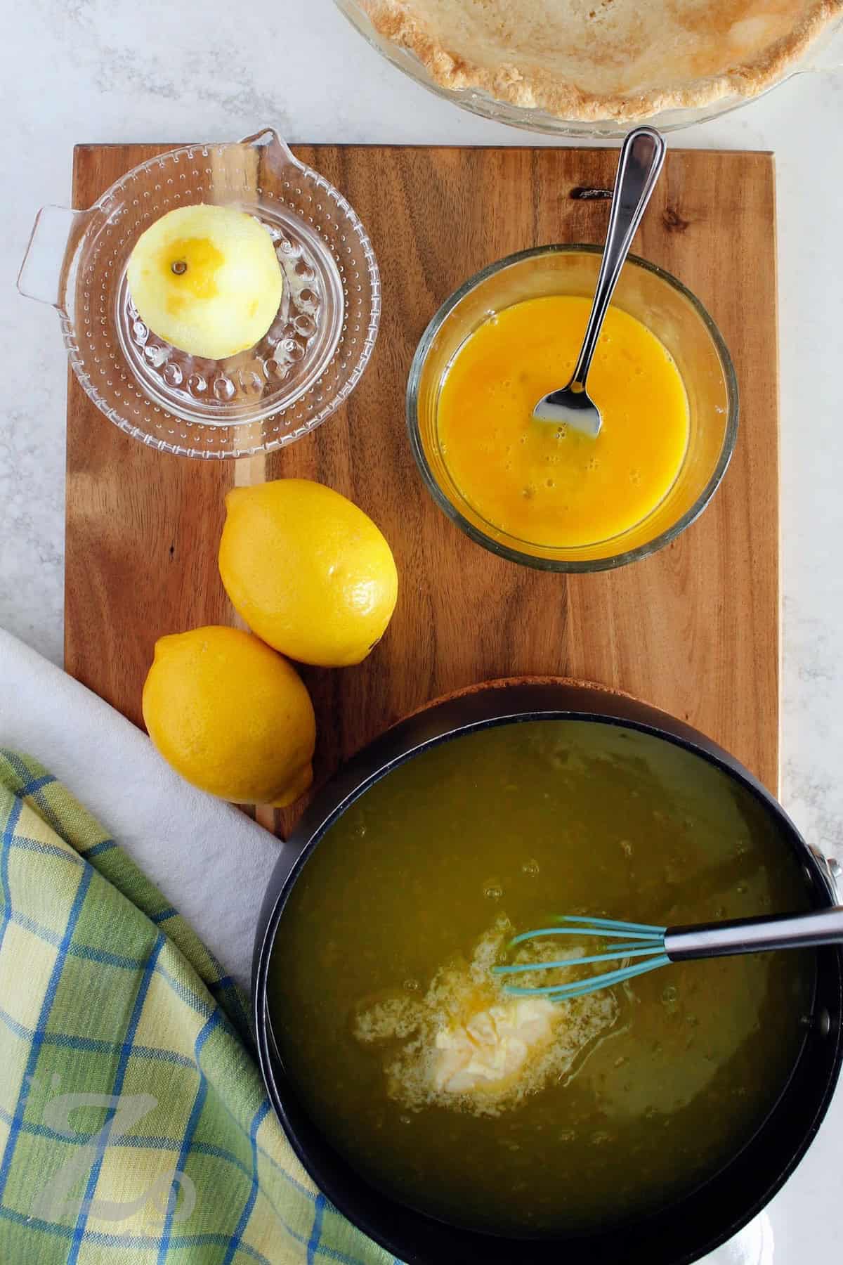 process to make this recipe for lemon meringue pie with butter added to the saucepan, but the egg yolks were not yet added