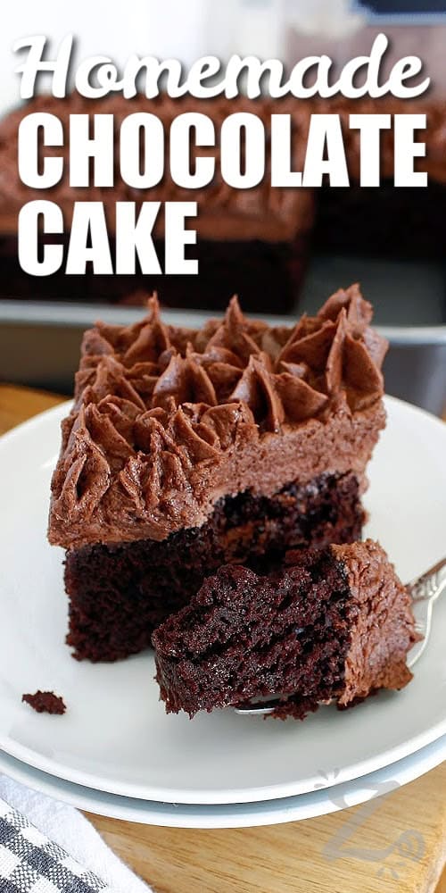 This homemade chocolate cake is rich, moist, and deeply chocolatey, made with simple pantry staples you likely already have on hand. It bakes up soft with a tender crumb and a bold cocoa flavor that tastes bakery-worthy without the fuss. Perfect for birthdays, holidays, or anytime chocolate cravings hit so why not giving it a try? #ourzestylife a slice of homemade chocolate cake on a white plate with a forkful in the front of the cake, with a title