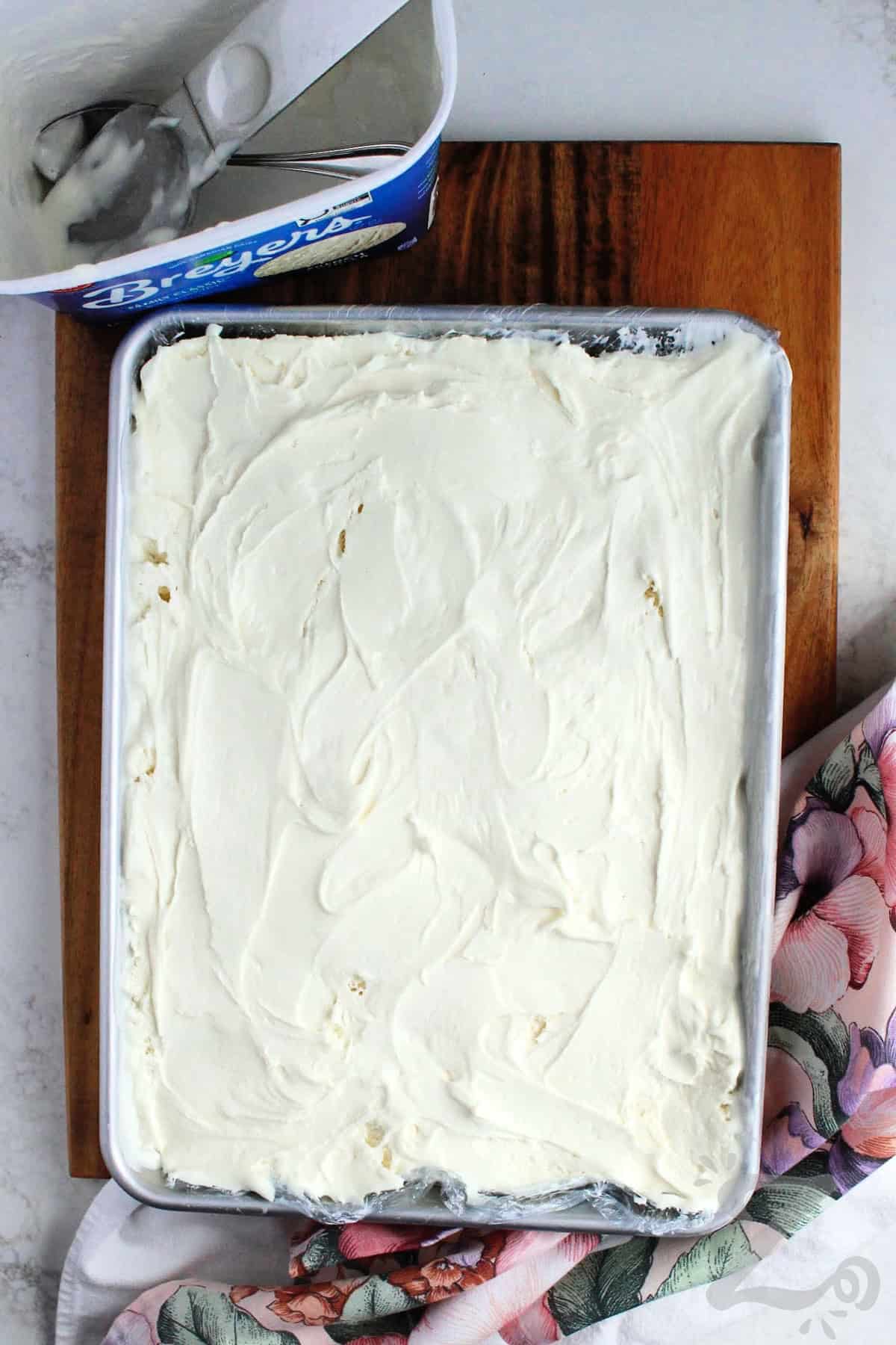 ice cream spread onto a baking sheet to make ice cream sandwich recipe