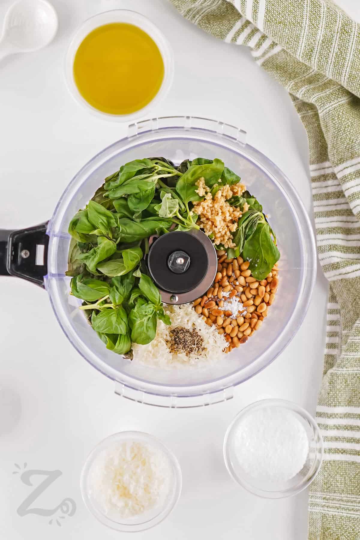 ingredients in a food processor to make Homemade Pesto