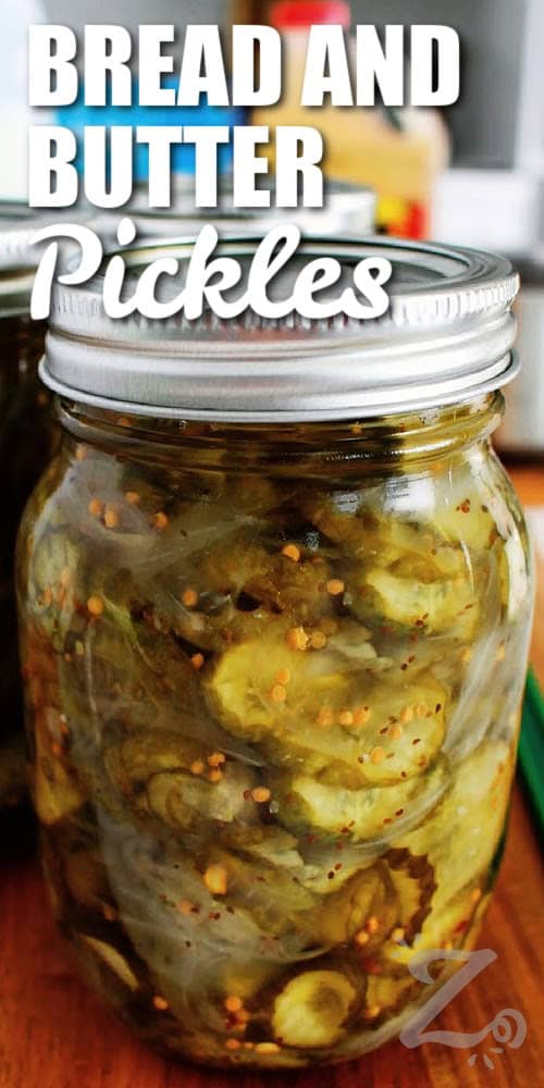 Preserve your fresh garden cucumbers with this easy Bread and Butter Pickles recipe! These sweet and tangy pickles are delicious on burgers, hot dogs, sandwiches, and charcuterie boards. Includes instructions for refrigerator pickles and water bath canning, so give it a try this summer. #ourzestylife bread and butter pickles recipe sealed in a mason jar with a title