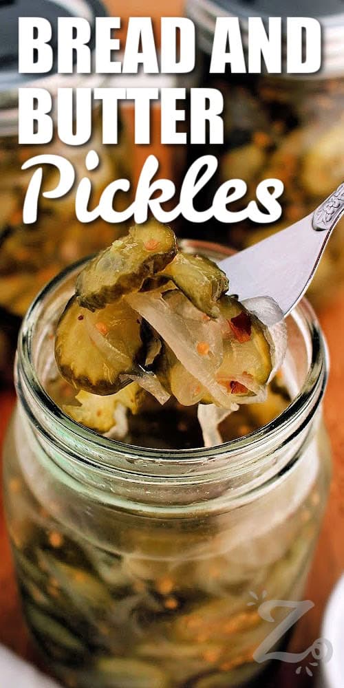 Looking for an easy Bread and Butter Pickles recipe? These old-fashioned sweet pickles are packed with crisp cucumbers, onions, mustard seed, and a flavorful vinegar brine. This is a recipe you can use for canning or refrigerator pickles. Give it a try and you'll want to make it every summer. #ourzestylife completed bread and butter pickles recipe in a mason jar with some on a fork with a title