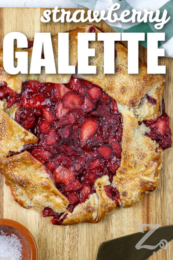 Strawberry Galette on a wooden board with writing