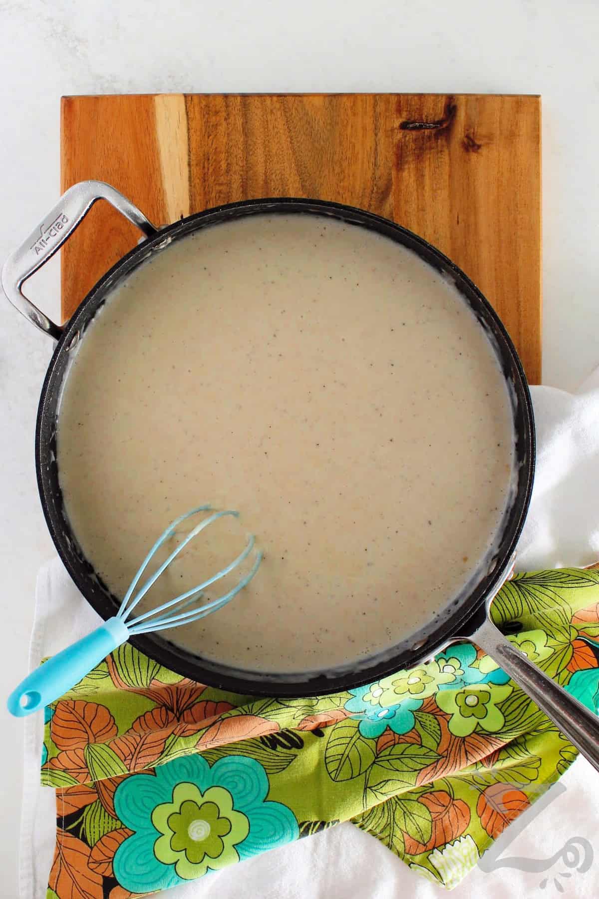country gravy in a saucepan to smother chicken fried steak