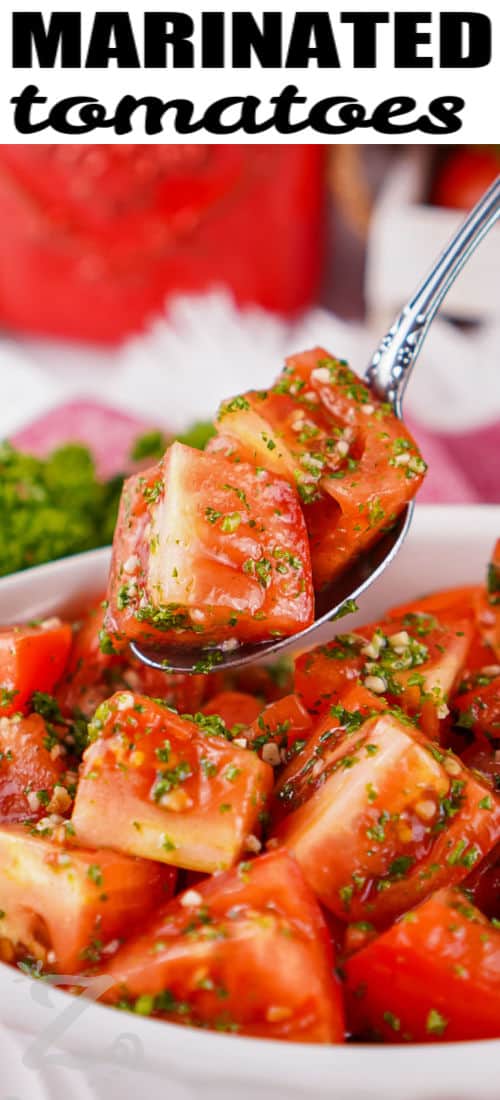 Looking for a fresh side? Marinated tomatoes combine juicy Roma tomatoes with garlic, lemon, parsley, and olive oil for plenty of bright flavor. The simple marinade lets the tomatoes soak up every delicious ingredient while keeping their fresh taste front and center. Serve them with grilled chicken, fish, or your favorite summer meals. Save this easy recipe and make it soon. #ourzestylife juicy Marinated Tomatoes with writing