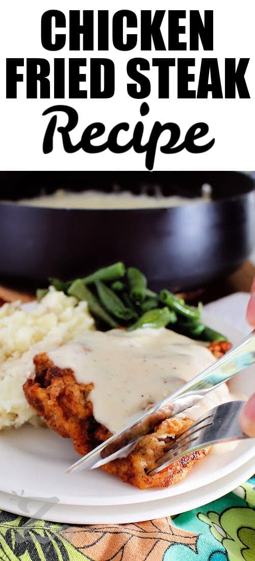 chicken fried steak with country gravy, where a knife and fork are slicing off a piece, with writing