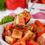 Marinated Tomatoes on a spoon