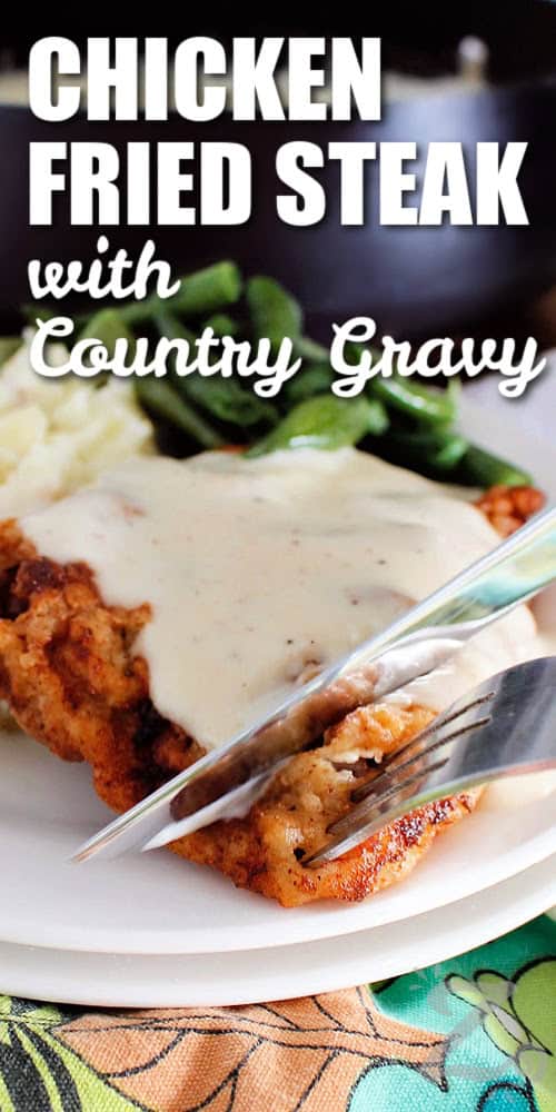 chicken fried steak with country gravy where a knife and fork are slicing off a bite sized piece, with a title