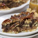 slice of Dark Chocolate Pecan Pie on a plate.