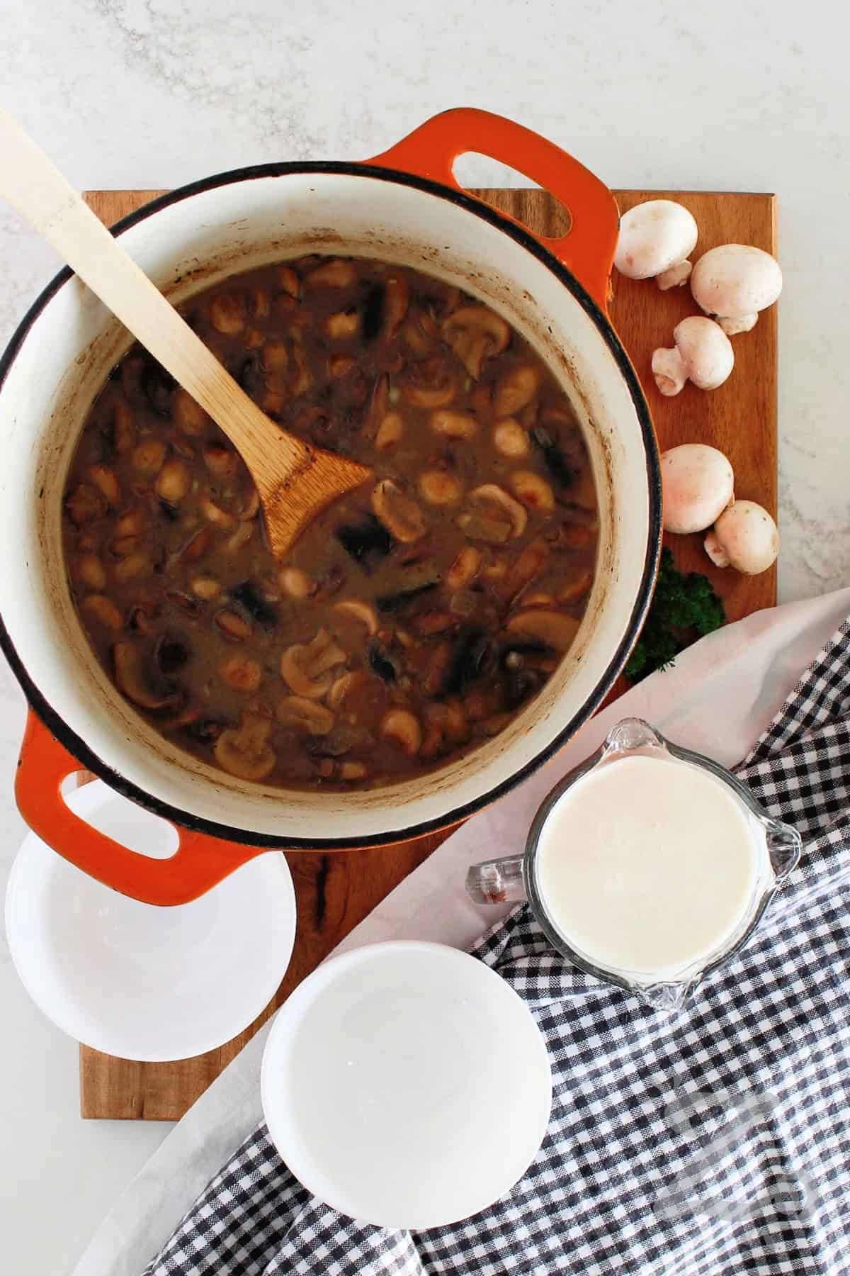 Homemade cream of mushroom soup in a pot before cream has been added.