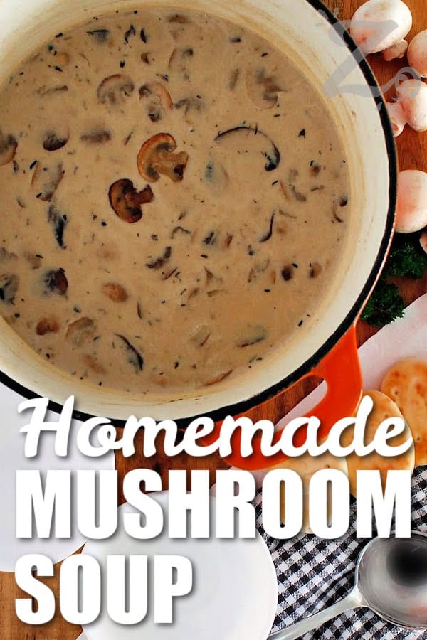 Homemade cream of mushroom soup in a pot with white bowls, mushrooms and pitas on the side, with a title.