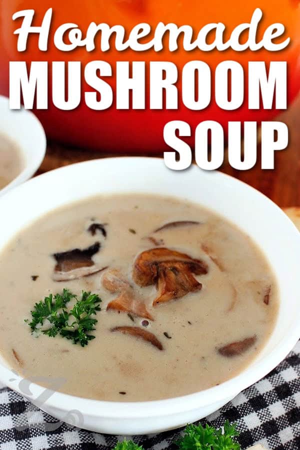 Homemade cream of mushroom soup in a white bowl and garnished with a mushroom and fresh parsley, with a title.